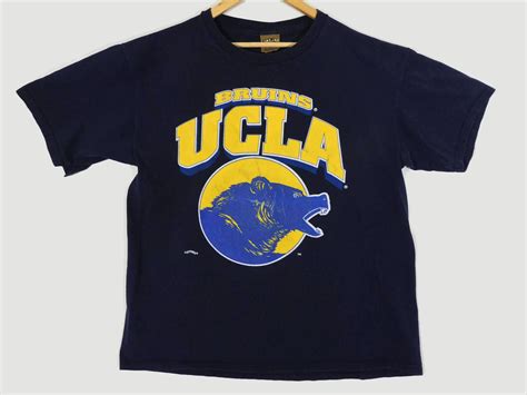 Most of them have pulled off the coolest 90s inspired looks, which i have compiled in this section. Vintage UCLA Bruins T-Shirt - XL - Nutmeg Sportswear - Los ...