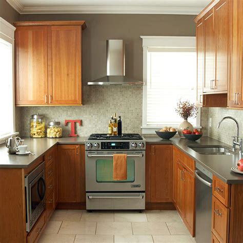 The work triangle flattens out by placing the sink between the range and the refrigerator for maximum efficiency. Compact kitchens that make the small space look bigger ...