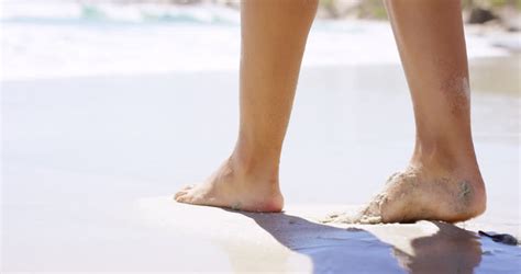 Close Up Of Woman Feet On Beach Girl Getting Her Toes Wet