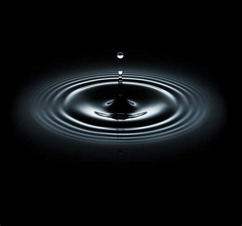 Water Drop Making Ripple On Black Photograph By Biwa Studio