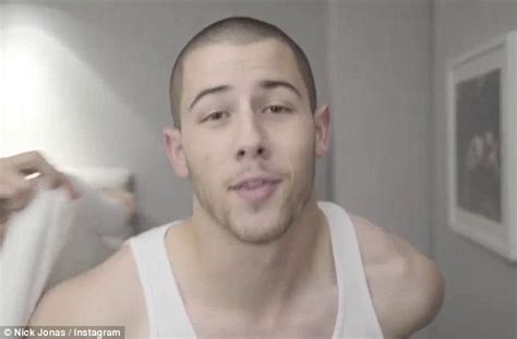 nick jonas flaunts his muscly biceps to announce new single levels daily mail online