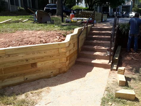 Stabilizing A Walkway With A Wooden Retaining Wall - Camden Landscape Group