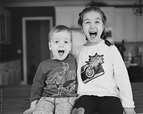 Brother And Sister Screaming Of Laughter By Stocksy Contributor Jakob Lagerstedt Stocksy