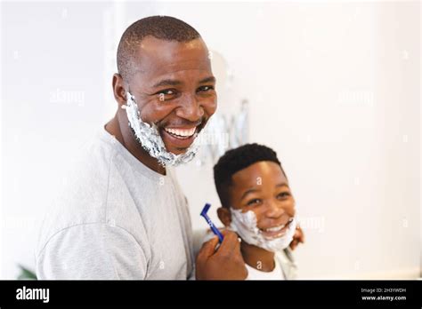 Portrait Of Smiling African American Father With Son Having Fun With