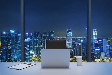 Office Window At Night Stock Photos Pictures And Royalty Free Images