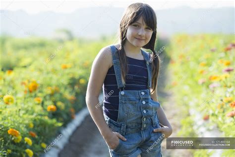 Teenage Girl Standing In Flower Field — Flower Farm Front View Stock