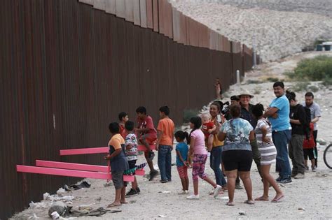 Seesaws Installed At Us Mexican Border For Children To Play Together In