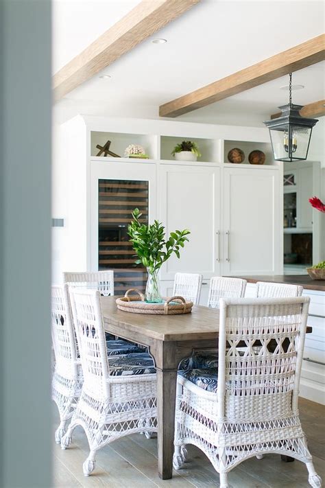 White rattan dining chair Rattan chairs make this space feel more