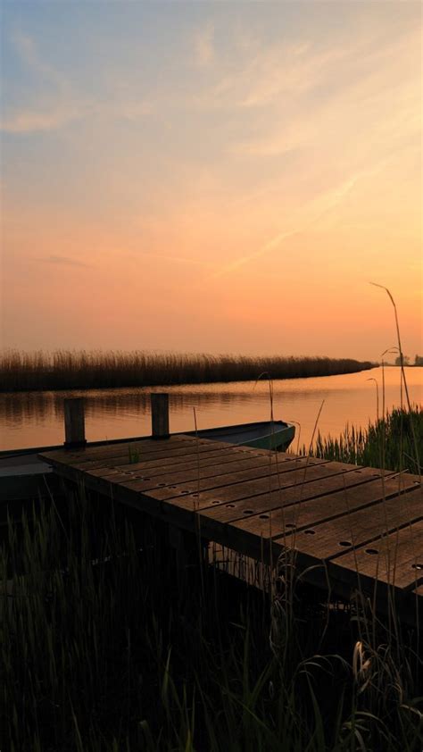 Beautiful Sunset With A Boat And Small Pier Schermerhorn Netherlands