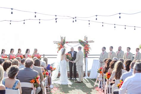 Tropical Beach Inspired Rooftop Waterfront Wedding Ceremony Gold And Coral Wedding Decor