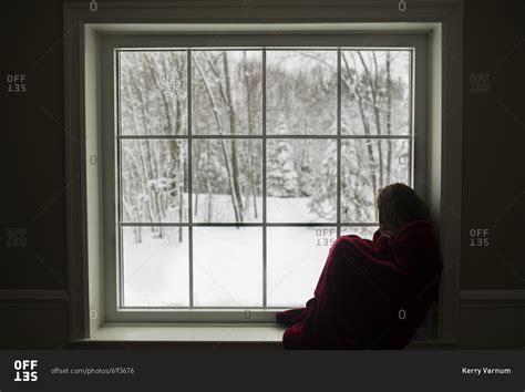 Cozy Girl Watching Snow In Windowsill Stock Photo Offset