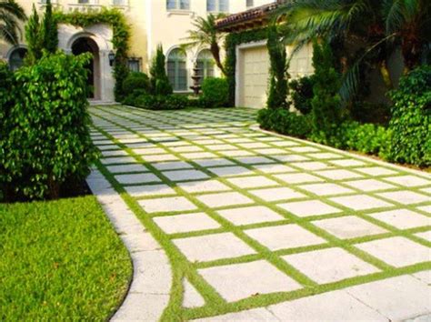 Geometric Pavement With Grass Trims For The Home Entrance With Trees