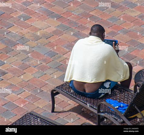Black Man Exposing His Butt Crack While Sitting On Lounge Chair Stock Photo Alamy