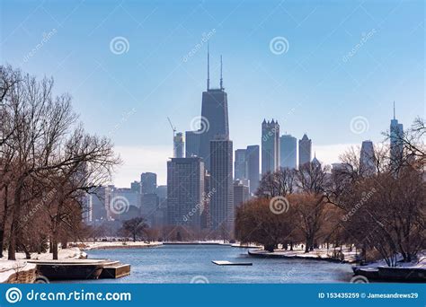 Chicago Skyline From The South Lagoon In Lincoln Park With Snow During