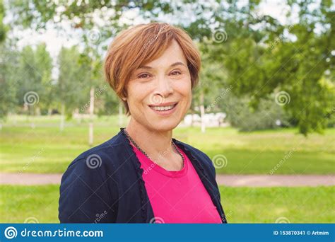 Closeup Portrait Of Healthy Smiling Older Woman Outdoors Elegant