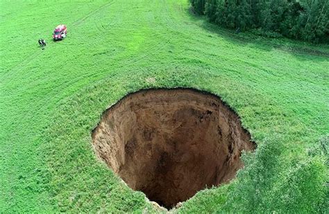 Massive 105 Foot Wide Sinkhole Abruptly Appears In Russian Field