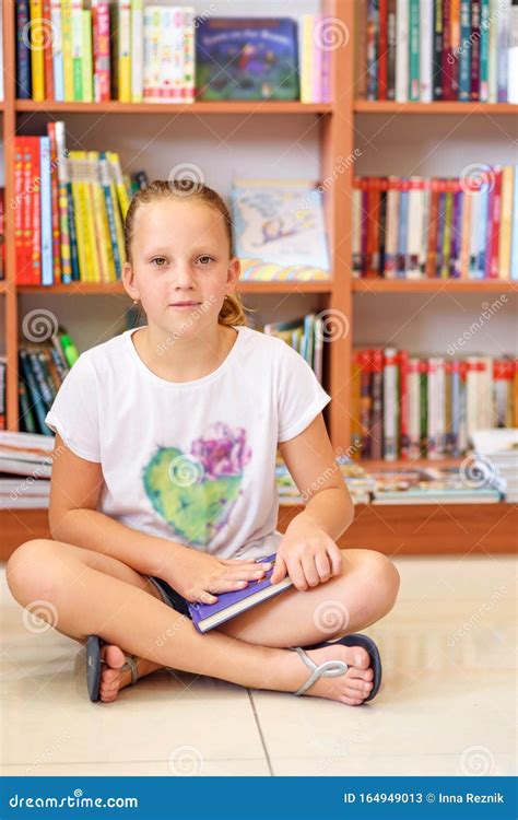 Young Girl Reading A Book Stock Image Image Of Library 164949013