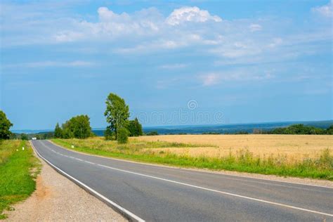 Country Road Summer Sunny Day White Clouds In The Blue Sky Stock