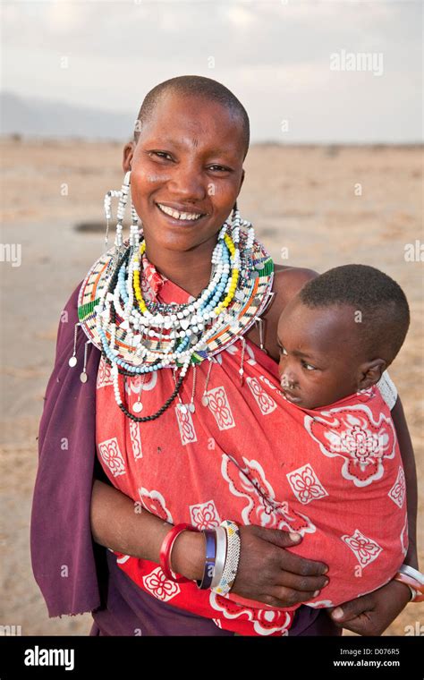 Happy Smiling Maasai Mother With Babies At Tanzaniaeast Africaafrica