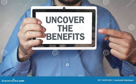 Man Showing Uncover the Benefits Word. Stock Photo - Image of facts