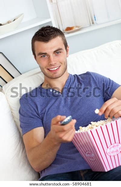 Charming Young Man Eating Popcorn Watching Stock Photo 58904681