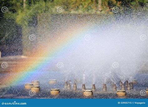 Splashing Water Of A Fountain With Rainbow Stock Image Image Of
