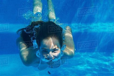 Underwater Portrait Of Girl Underwater Swimming In Swimming Pool