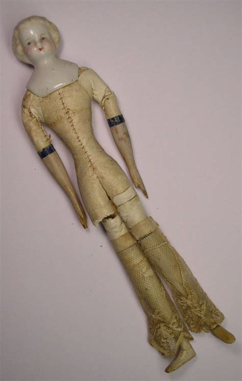 ANTIQUE CHINA HEAD DOLL WITH LEATHER BODY WOOD ARMS LEGS China Head