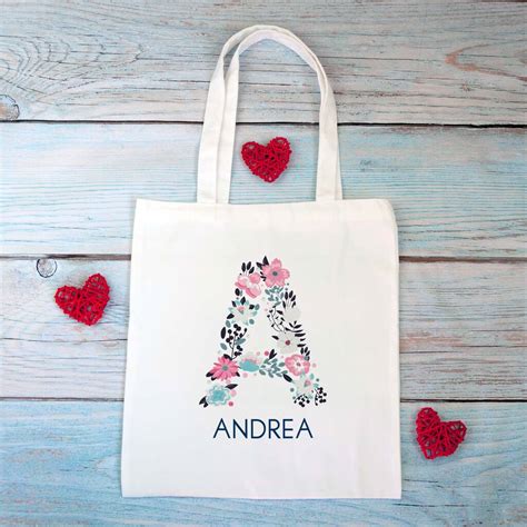 floral initial personalised tote bag by chips and sprinkles