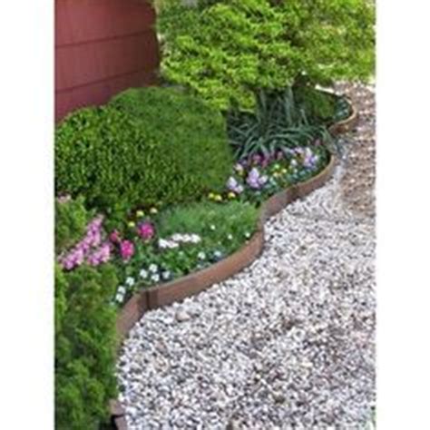 Garden composite landscape edging is a product that is designed to create a separation between one part of a property and another. Scenery Solutions LEK-CIR Composite Wood Undulating Garden ...