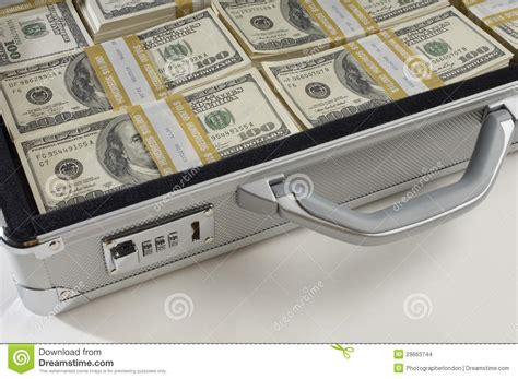 Woman holding briefcase full of money. Briefcase Full Of Money Stock Images - Image: 29663744