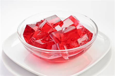 Cubes Of Red Jelly On A Glass Dish On A White Plate Stock Photo