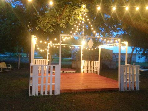 Whether hung above the dance floor or the reception seating, string lights can make any outdoor spot feel instantly cozier. Dance floor (for my wedding) made of pallets..... Awesome ...
