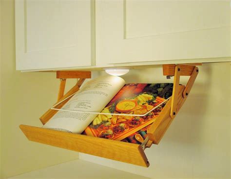 Before i found my pot rack, i looked at other options on pinterest. Ultimate Kitchen Storage Under Cabinet Lighted Cookbook ...