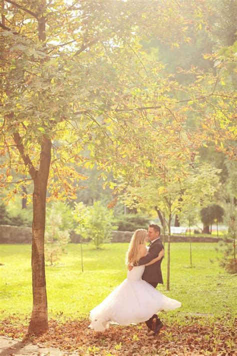 Groom And Bride Kissing In The Park Stock Image Image Of Engagement Kissing 57103457