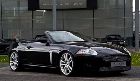 Black Cabriolet Jaguar Luxury Convertible Car On Road