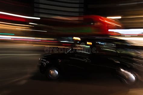 Car On The Road Surrounded By Lights With Long Exposure During The