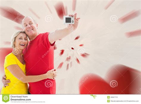 Composite Image Of Happy Mature Couple Taking A Selfie Together Stock