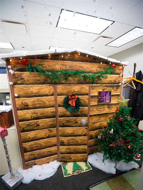 Consider bringing in a small christmas tree or menorah to showcase on your desk. Work Cubicle turned into a Christmas Log Cabin. Made out of cardbo… | Christmas cubicle ...