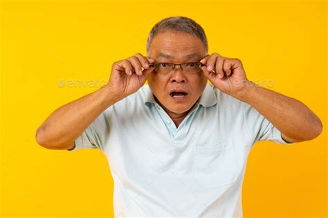 Take Off Put On Glasses Close Up Portrait Of Old Man Shocked Surprised