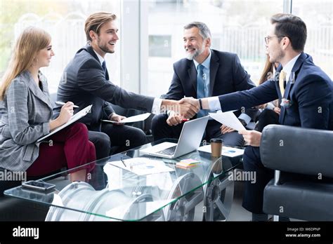 Business People Shaking Hands Finishing Up A Meeting Handshake