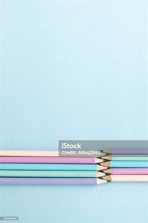Pastel Colored Pencils On Empty Sheet Blue Toned Stock Photo Download