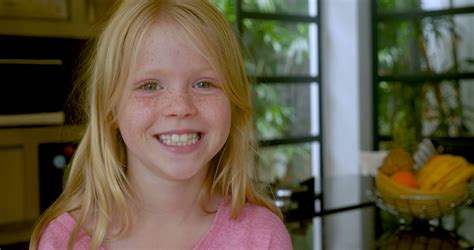 Blond Haired Young 7 10 Year Old Girl With Freckles Smiling And Looking