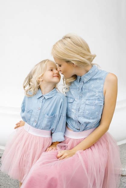 Premium Photo Beautiful Young Mother And Her Daughter Wearing The