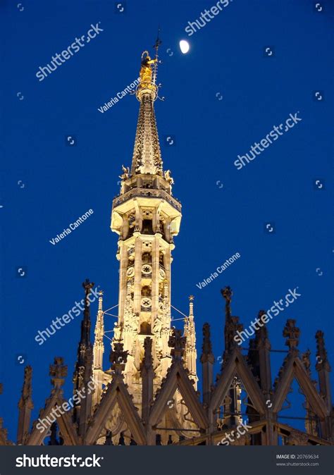 The Main Pinnacle Of Milan Cathedral With The Madonnina Statue On The