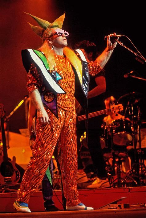 See Photos Of Iconic Elton John Performances And Wild Outfits Over The
