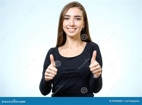 Smiling Happy Young Brunette Woman Showing Thumbs Up Gesture Stock