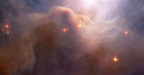 Hubble Reveals Billowing Clouds Of Cosmic Dust