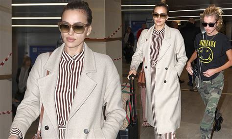 Irina Shayk Oozes Sophistication In A Cream Striped Ensemble As She And