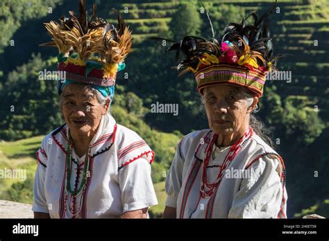 Two Senior Ifugao Women In Traditional Costume Banaue Rice Terraces In The Background Banaue